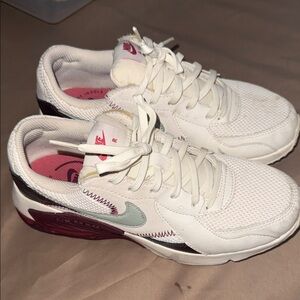 Nike Women's White Athletic Sneakers with Pink Accents